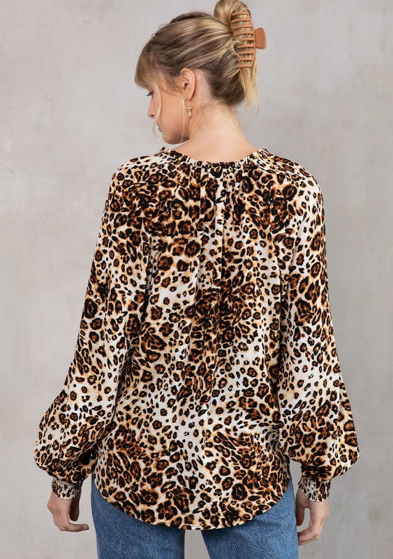 The Tres Bon Leopard Print Tassel Top