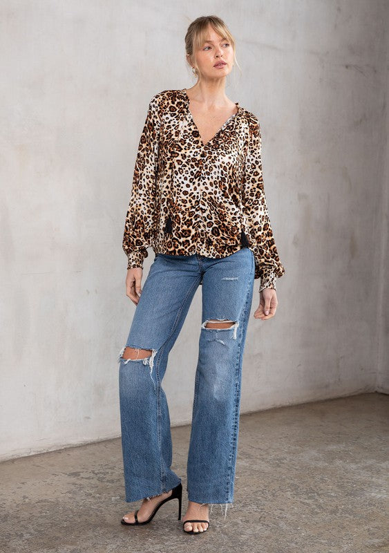 The Tres Bon Leopard Print Tassel Top