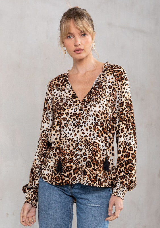 The Tres Bon Leopard Print Tassel Top